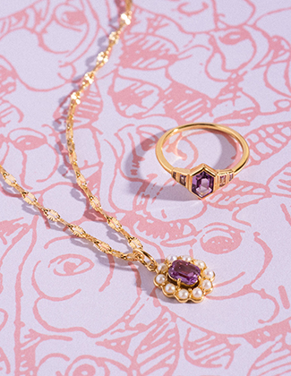 A selection of ring clips and stacking rings on a zoomed in hand showcasing natural beauty and showcasing well lit jewelry