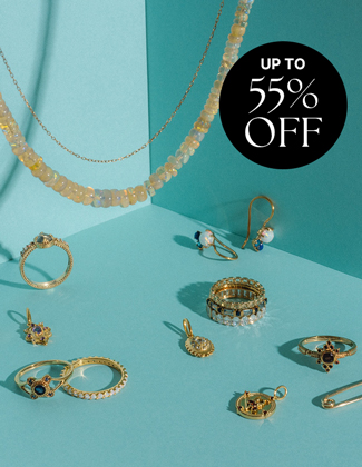 Image of multiple rings, earrings, and necklaces on a teal background