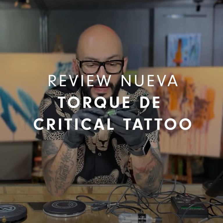 Tattoo artist reviewing Critical Tattoo Torque device.