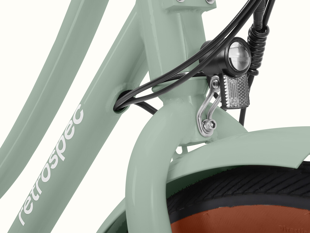 A close-up of the Beaumont Rev 3 City Electric Bike - Step Through's headlight.