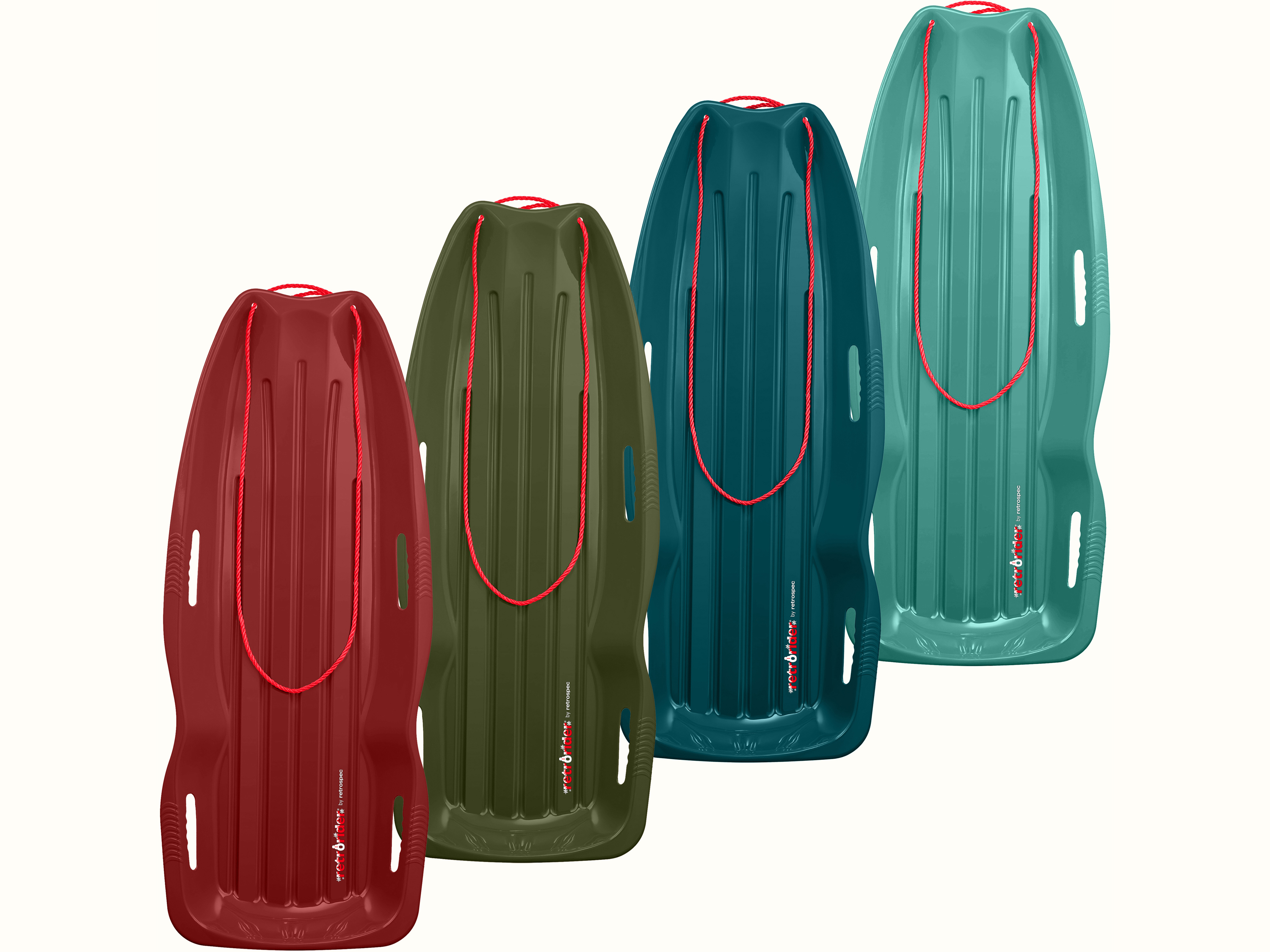 Three Retrorider Toboggan Snow Sleds with a red rope on a white background.