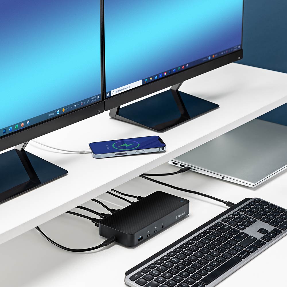 13 Port  Docking Station  SideTrak  13-Port Docking Station Hub  Experience organized tech with SideTrak's robust docking station, central to an array of devices including monitors and laptops, highlighting its essential role in a high-performance workspace.