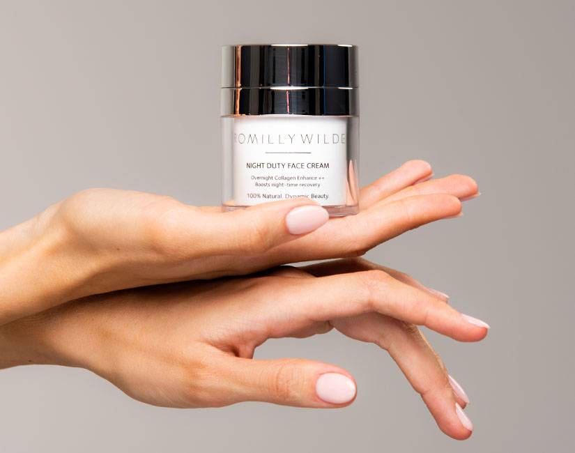 Night Duty Face Cream in woman's hands