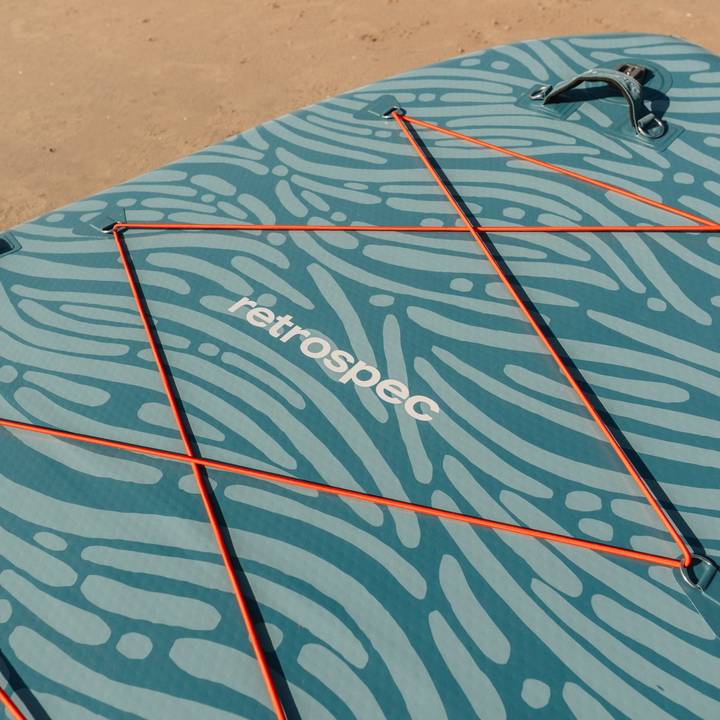 A close-up of the nose of the Weekender Crew Inflatable Stand Up Paddle Board with bungee storage area and handle.