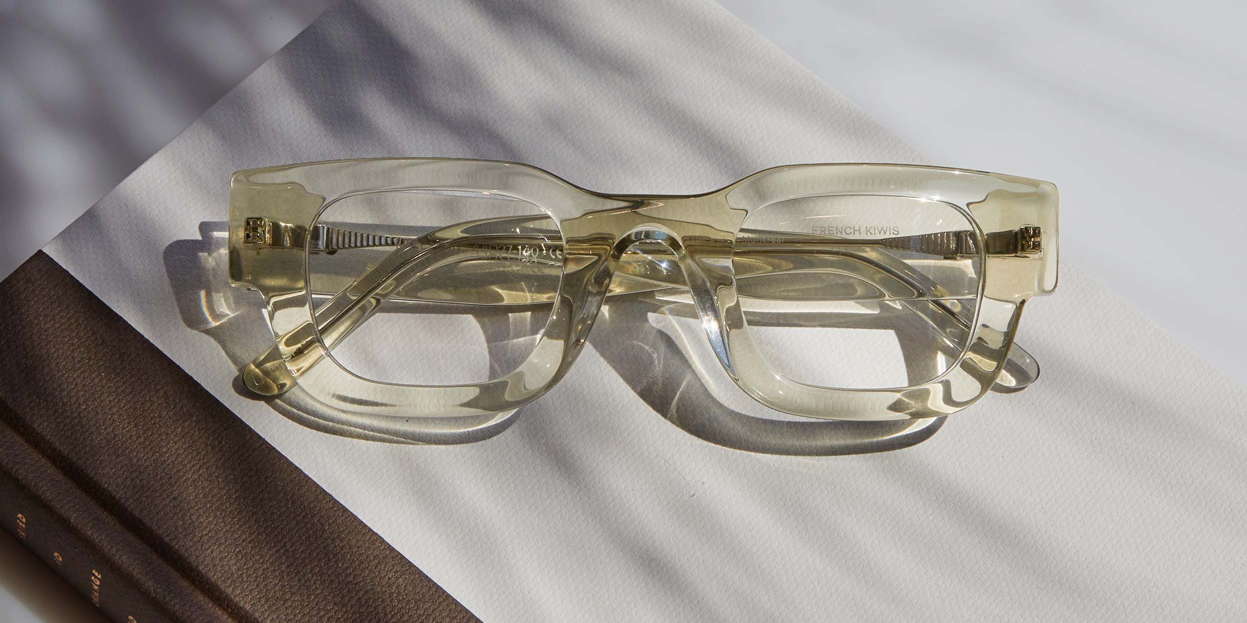 Photo Details of Valentin Clear Olive Reading Glasses in a room