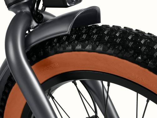A close-up of the Matte Graphite Boca Rev 2 Electric Tricycle's tire showcasing the tread.