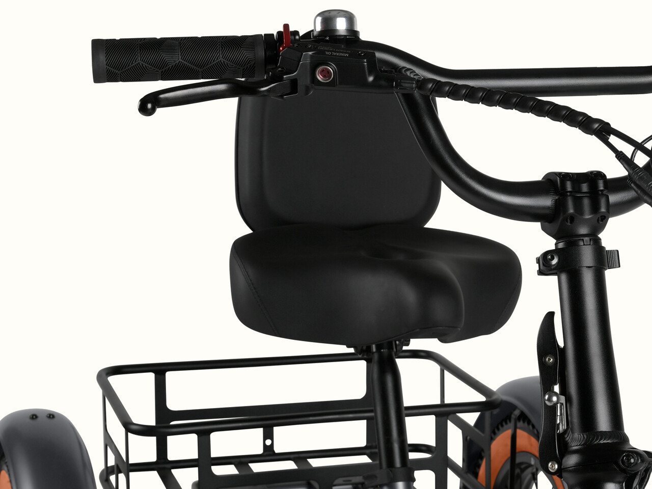 A cropped image of the Matte Graphite Boca Rev 2 Electric Tricycle focusing on the cushioned seat.