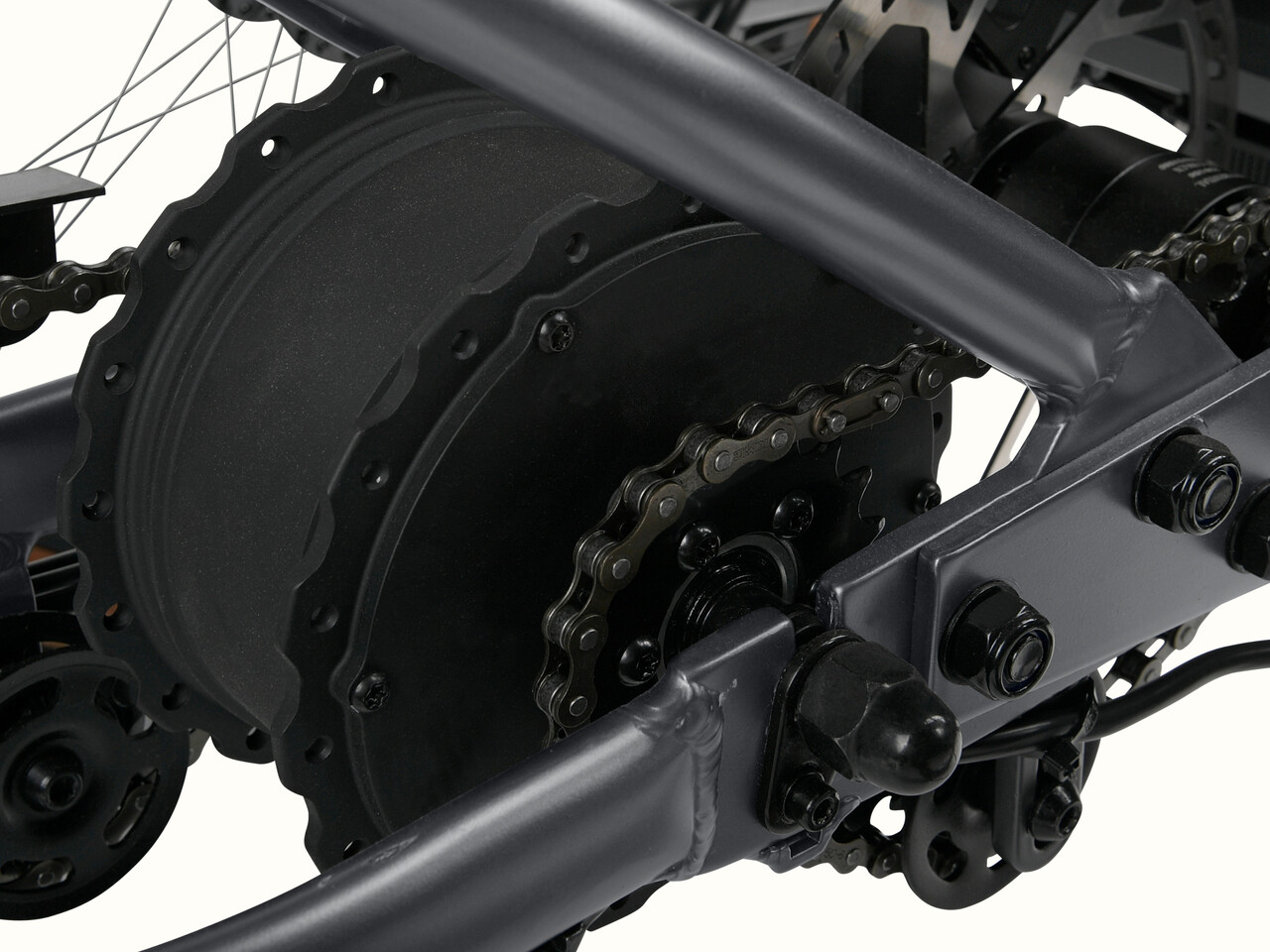 A close-up of the Matte Graphite Boca Rev 2 Electric Tricycle's brakes.