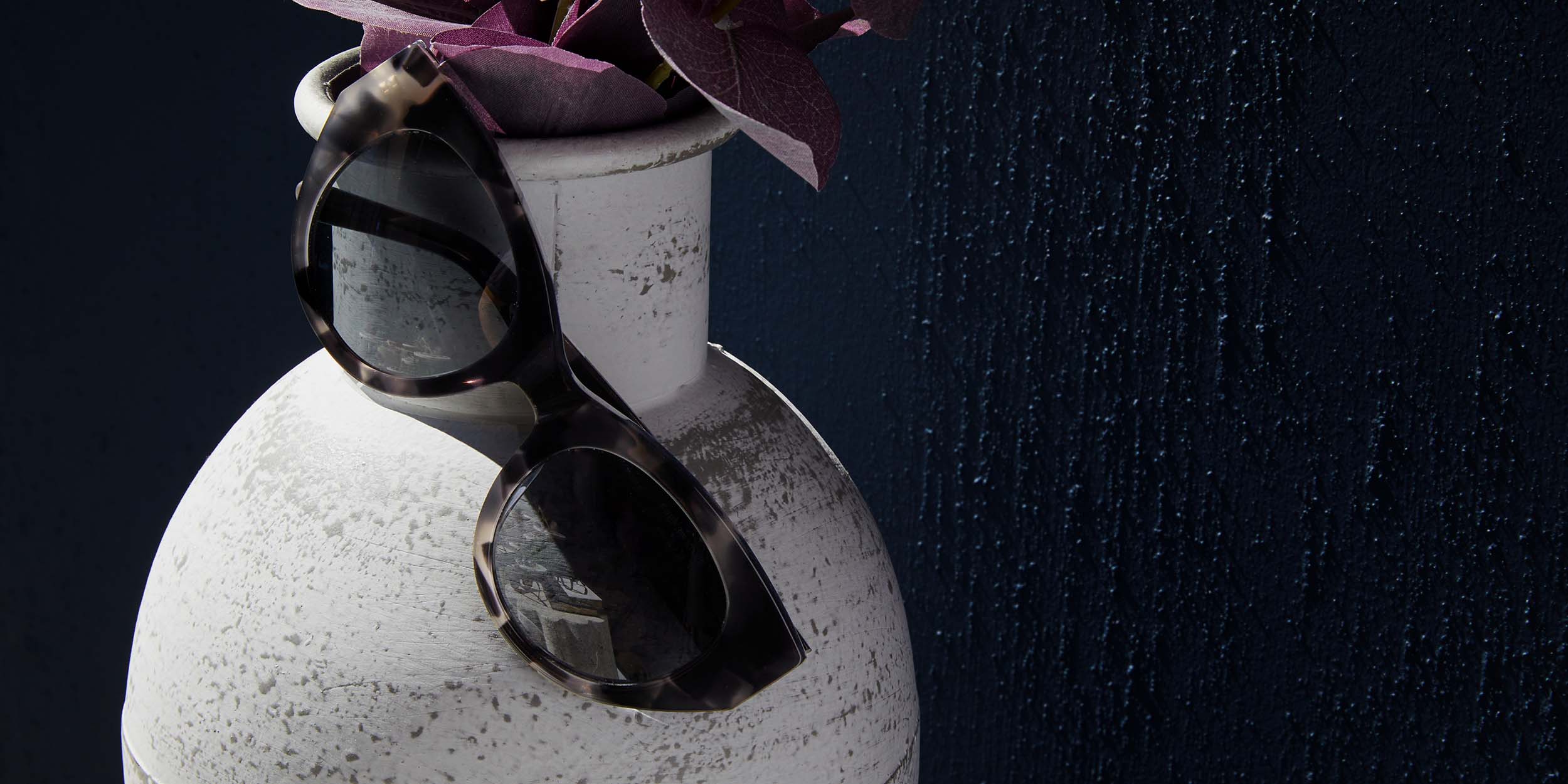 Photo Details of Jackie Sun Black Marble Sun Glasses in a room
