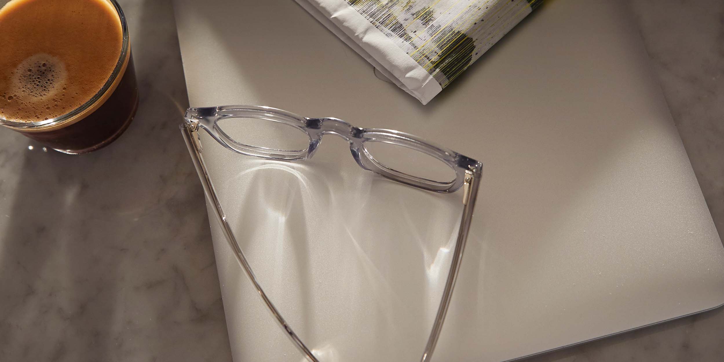 Photo Details of Thomas Clear Grey Reading Glasses in a room