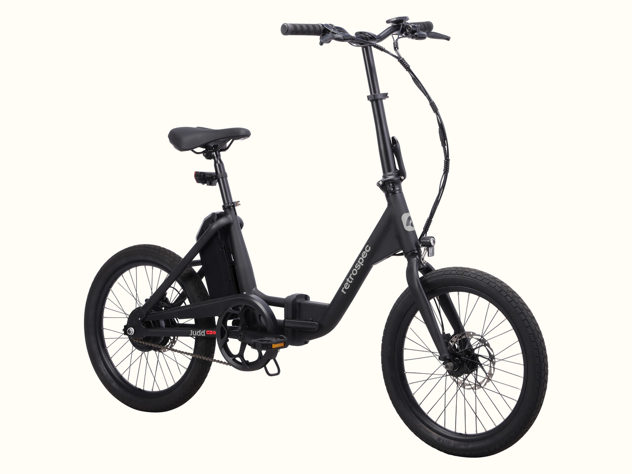 A sleek, black Judd Rev 2 Folding Electric Bike with a compact frame, minimalist design, and small tires, ideal for urban commuting.