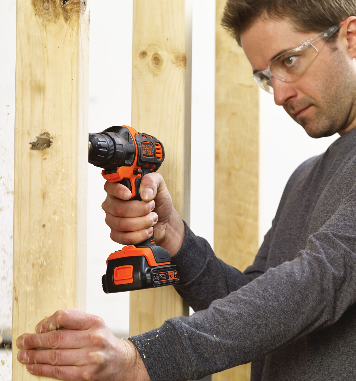 Person using MATRIX 20 Volt MAX Lithium Drill and Driver to drill a hole into a stud with a spade bit.