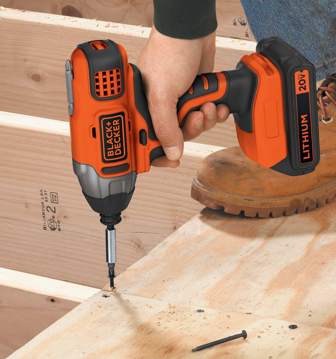 20 Volt MAX Lithium Impact Driver being used to drive screw downward into wood.