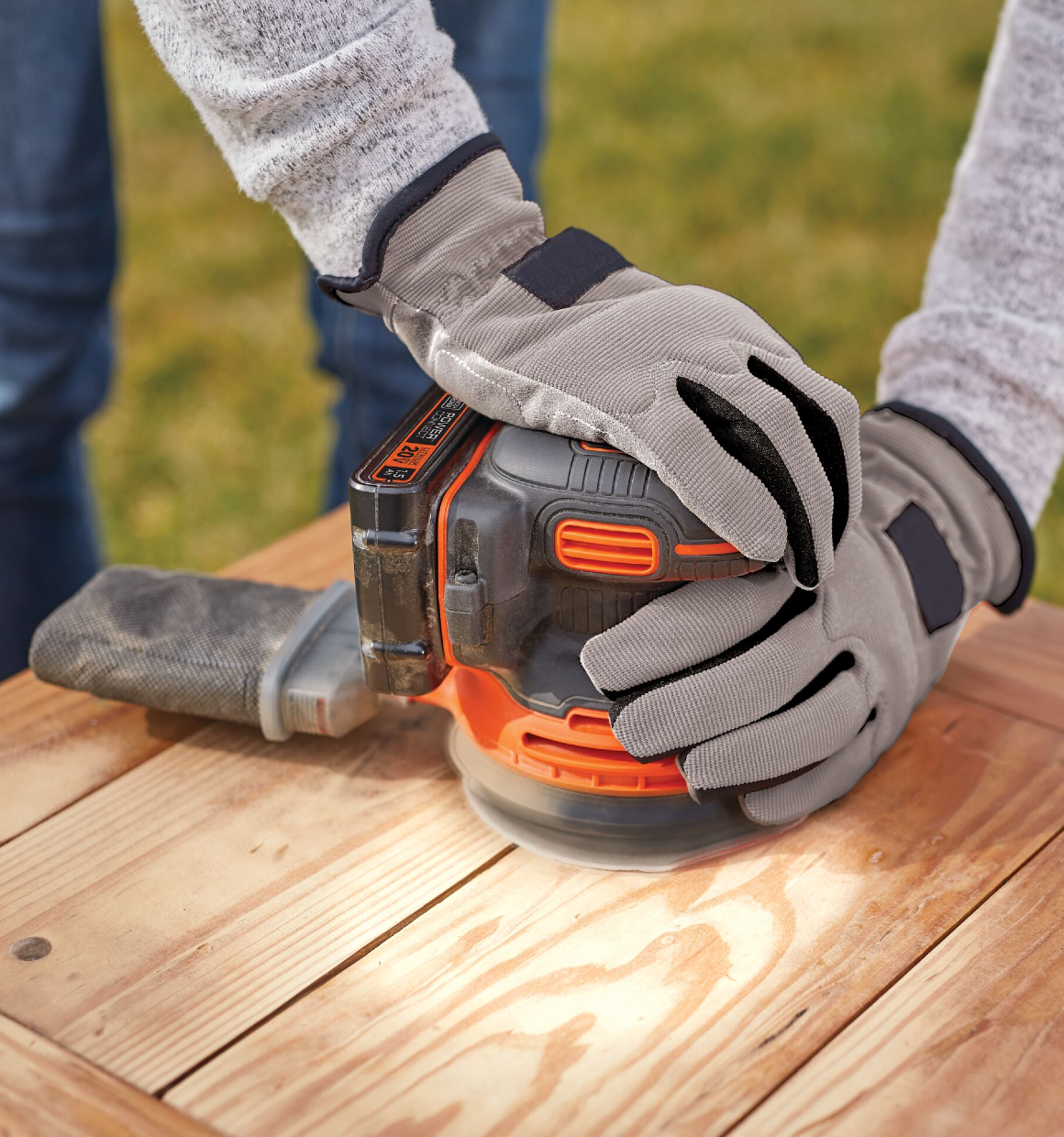 Cordless Random Orbital Sander being used to sand wood.