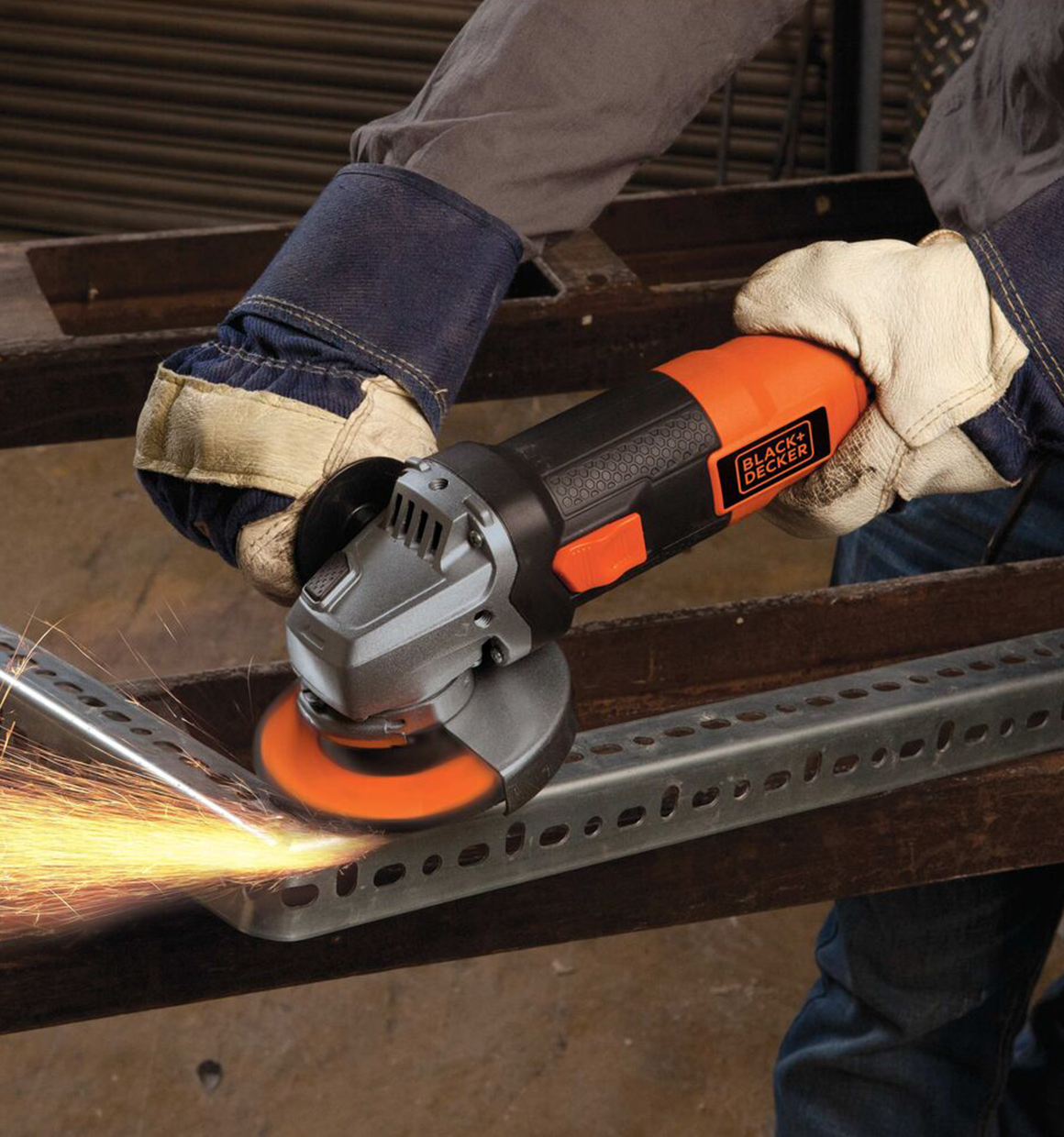 4 and half inch 6.5 Amp angle grinder being used by a person to grind metal surface.