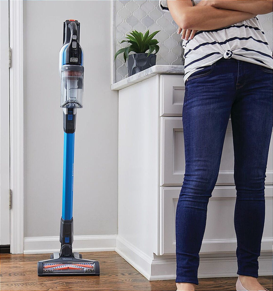 Powerseries extreme pet cordless stick vacuum cleaner being placed inside a house.