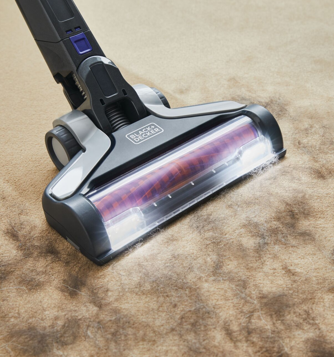 POWER SERIES Extreme Pet Cordless Stick Vacuum Cleaner being used to clean pet hair from rug.