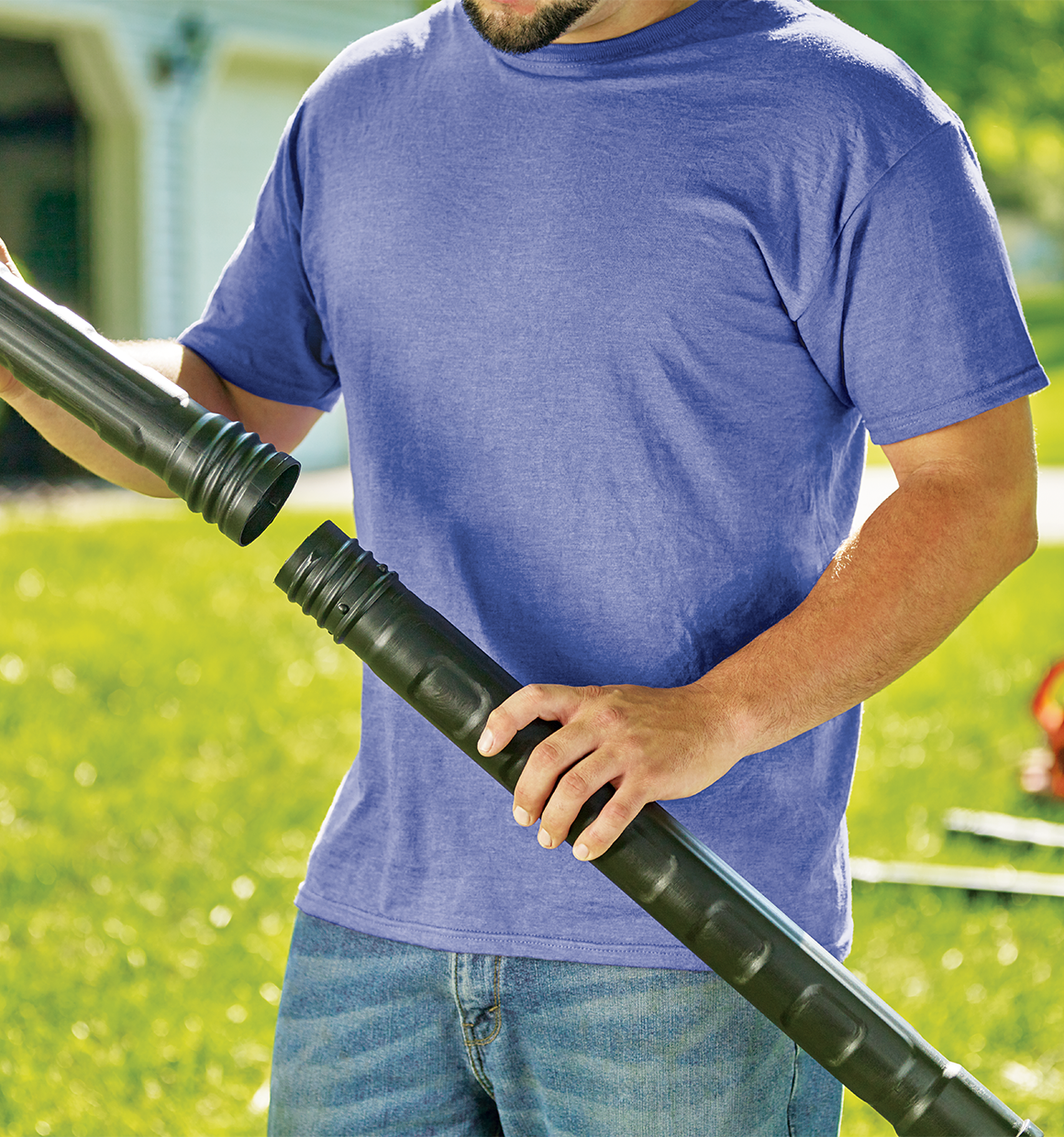 Gutter cleaner attachment being assembled by a person.