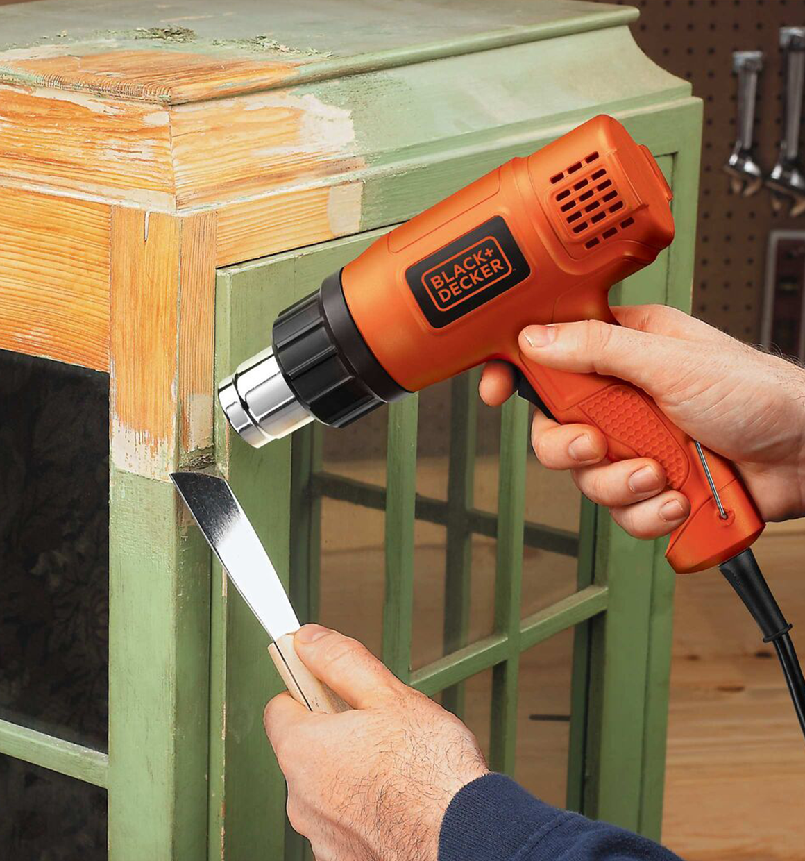Dual temperature heat gun being used.