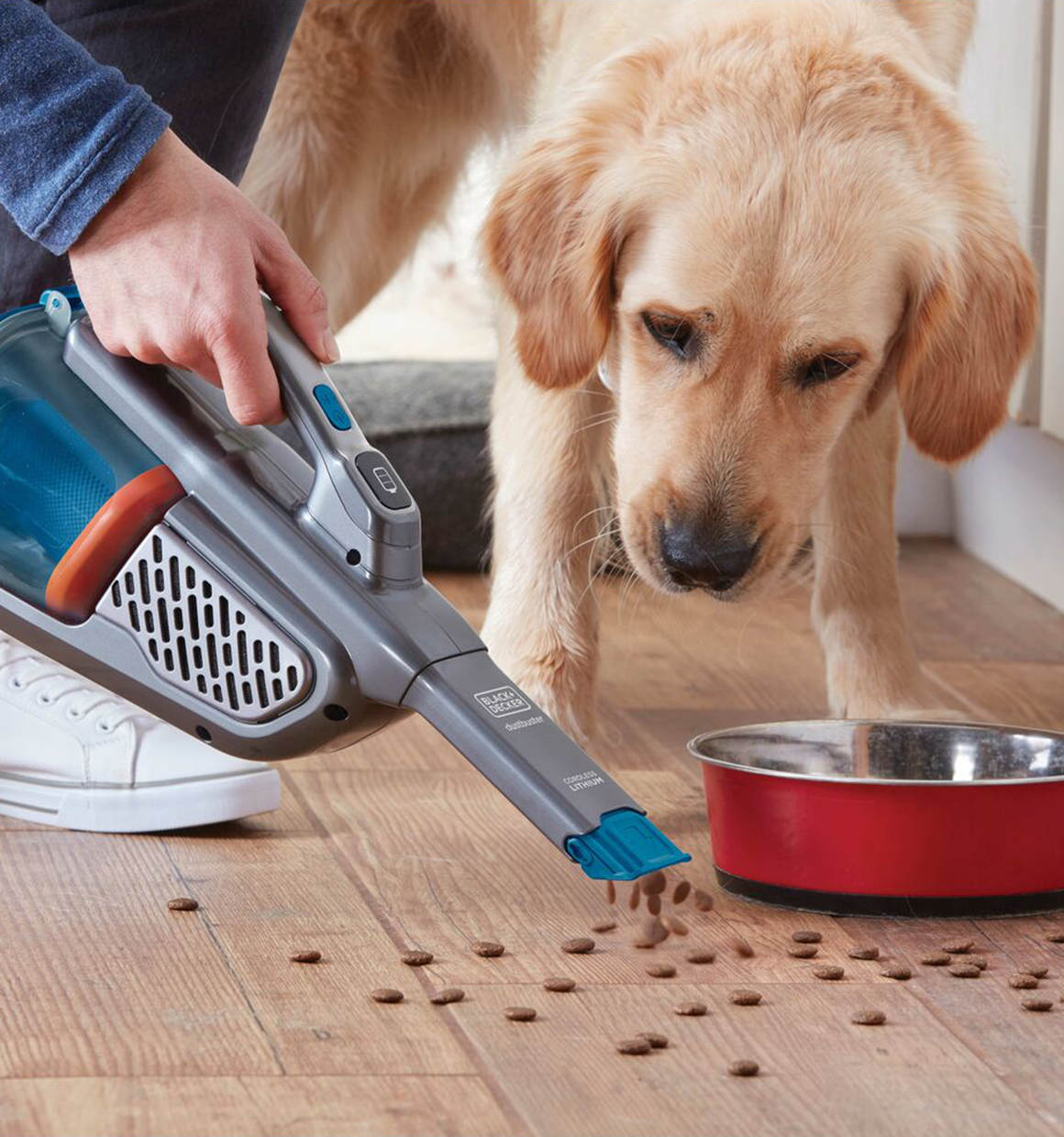 12 volt max dustbuster advancedclean cordless hand vacuum being used by a person.