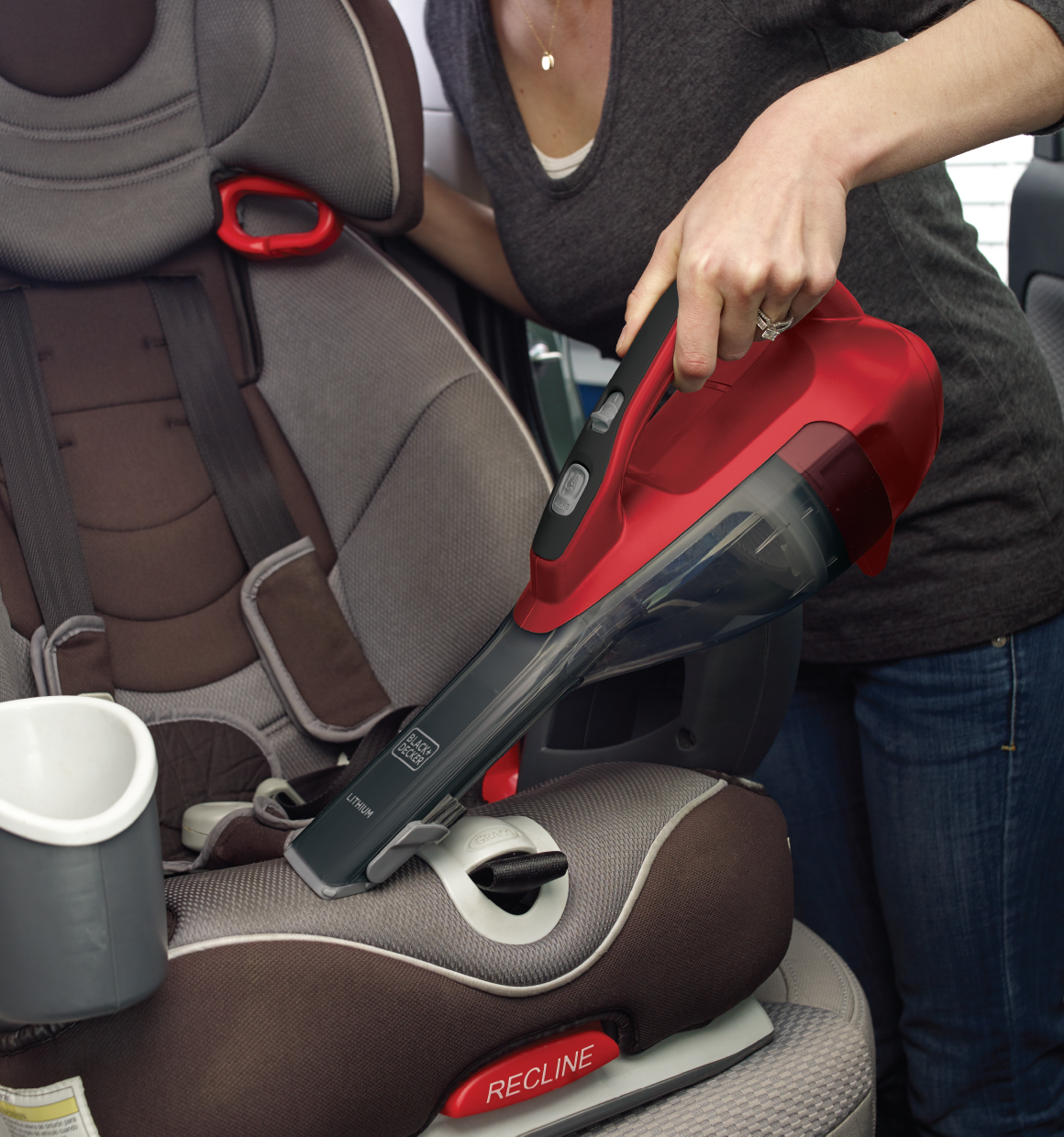 Dustbuster advanced clean cordless hand vacuum being used to clean car seats.