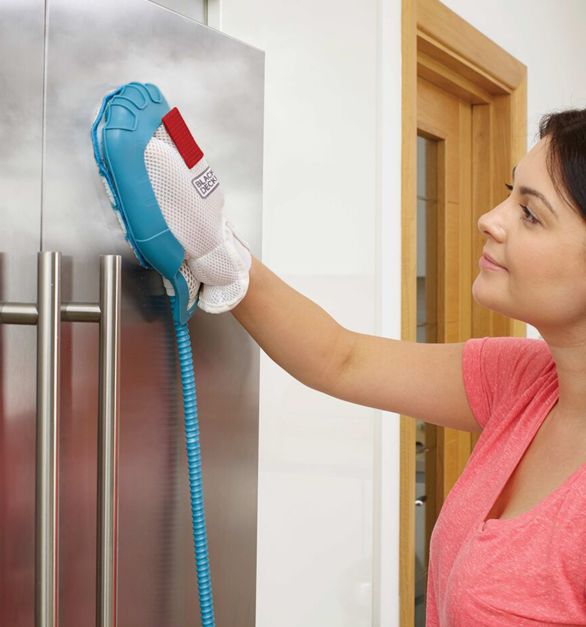 7 in 1 steam mop with steamglove handheld steamer being used by a person.