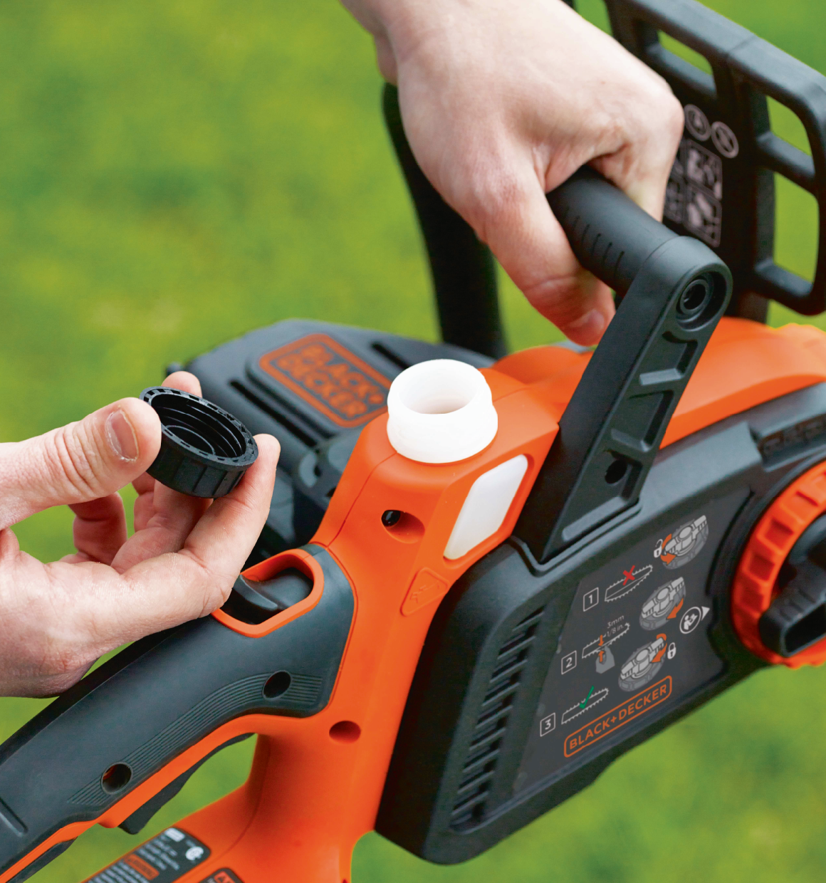 Person holding cap for Lithium 12 inch Chainsaw.