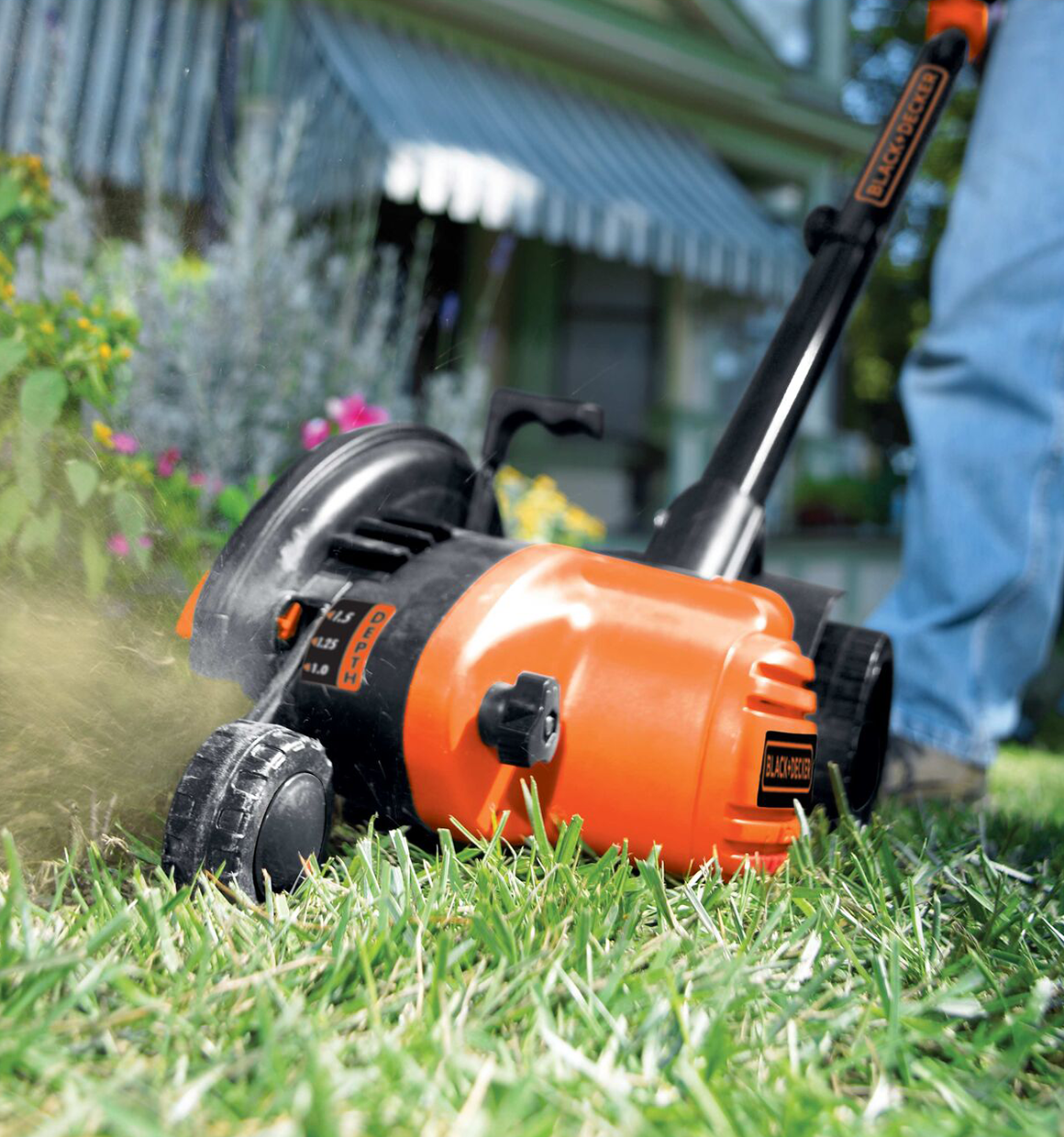 2 in 1 Landscape Edger and Trencher being used to edge around green grass.