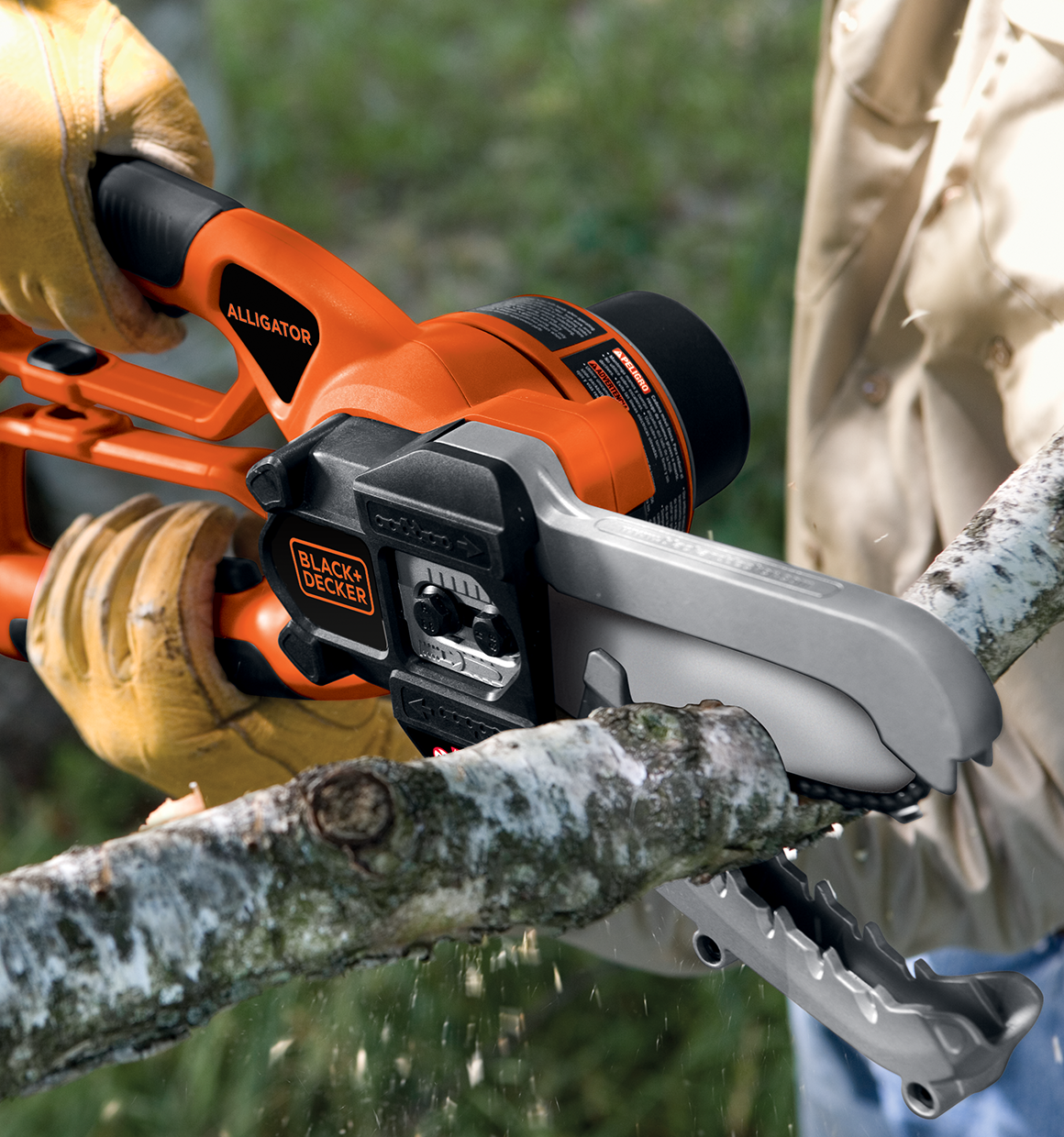 Lithium Alligator Lopper being used to cut branch.