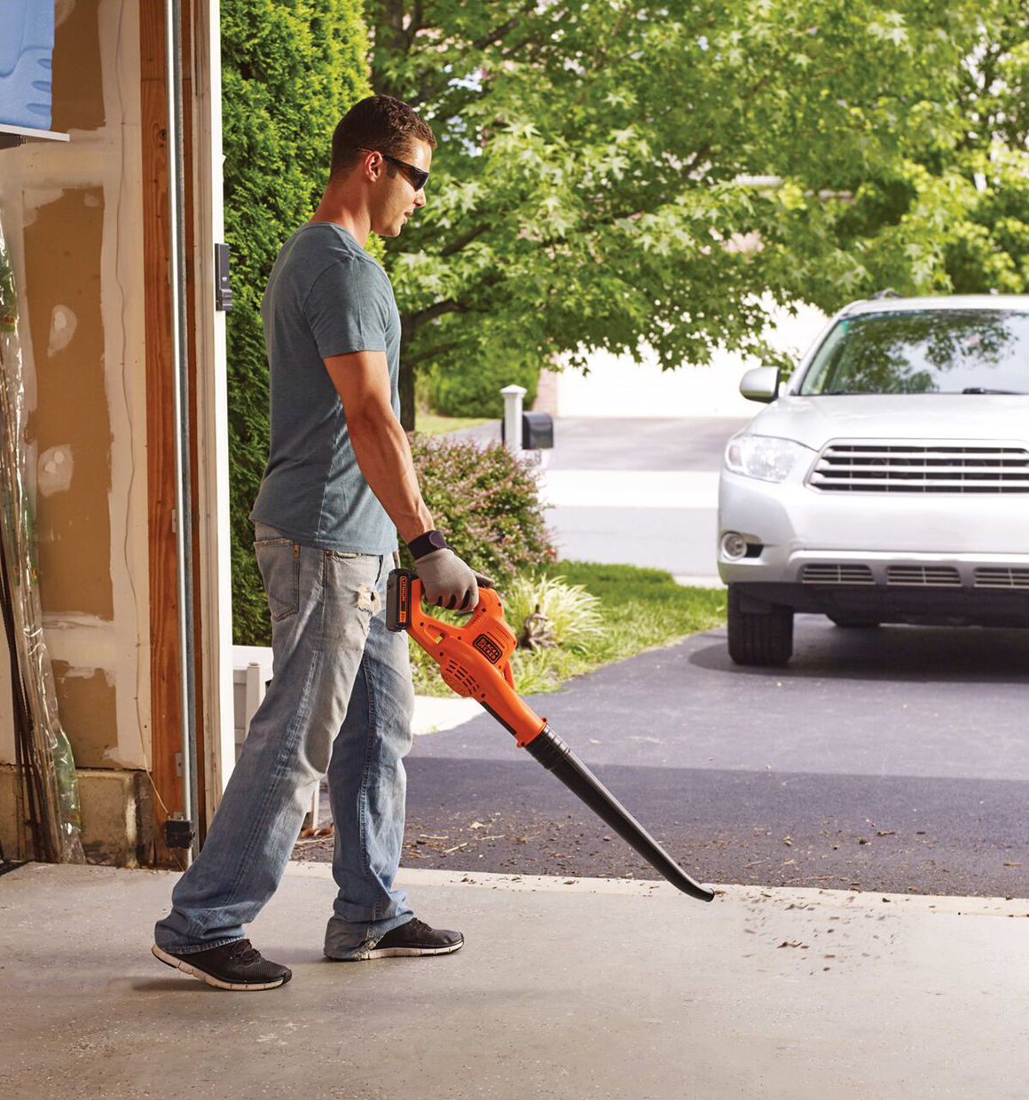 20 Volt Lithium Sweeper being used by a person