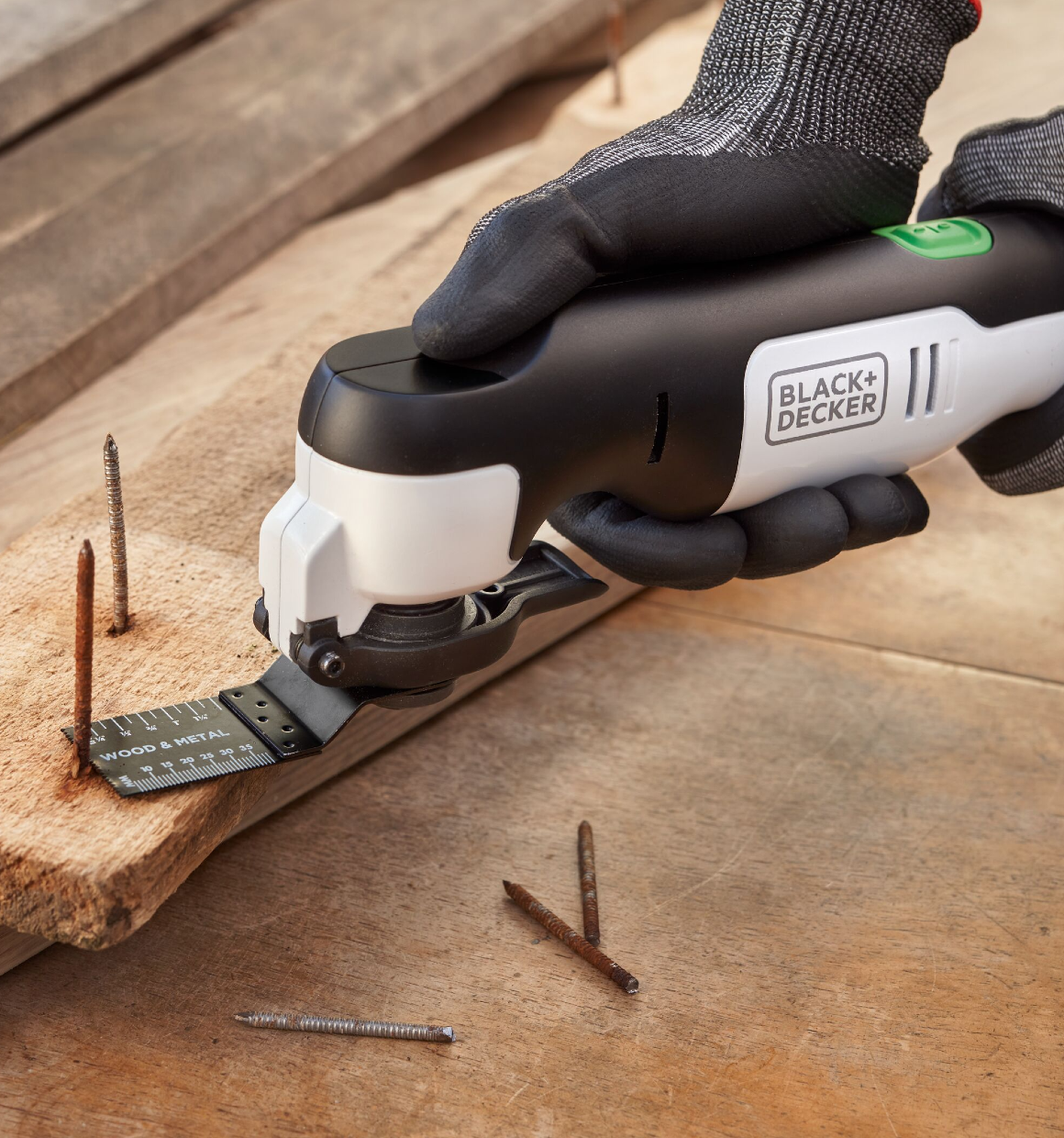 Reviva 12V Oscillating Multitool cutting rusty screws off of a pallet.