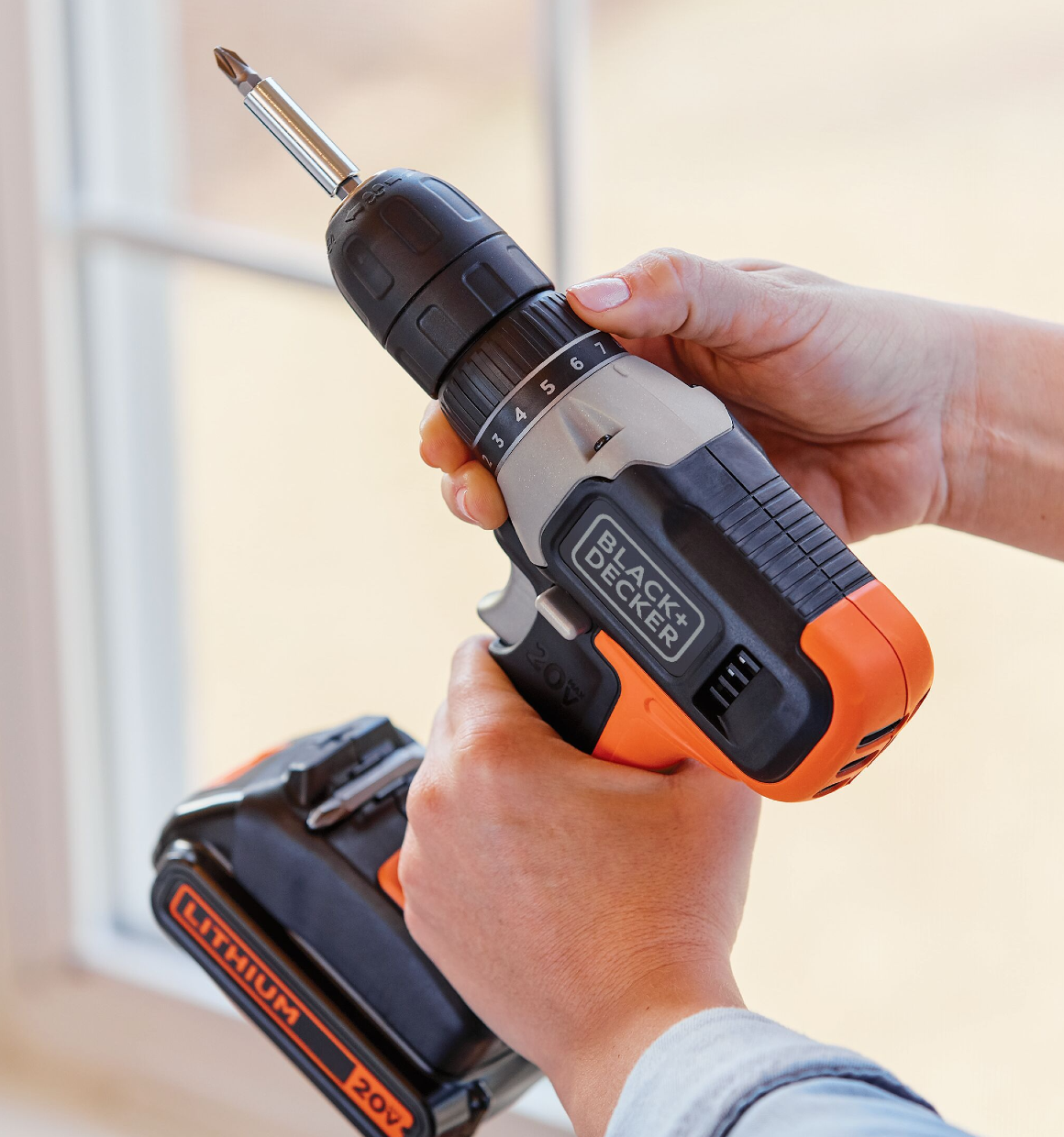Person making clutch adjustment on 11-position clutch of 20V max lithium ion drill/driver.