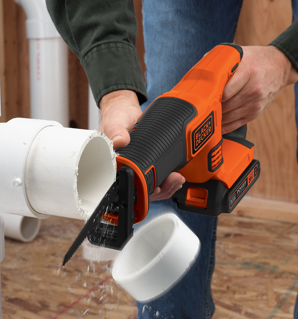 20V Max Cordless Reciprocating Saw being used to cut PVC pipe.