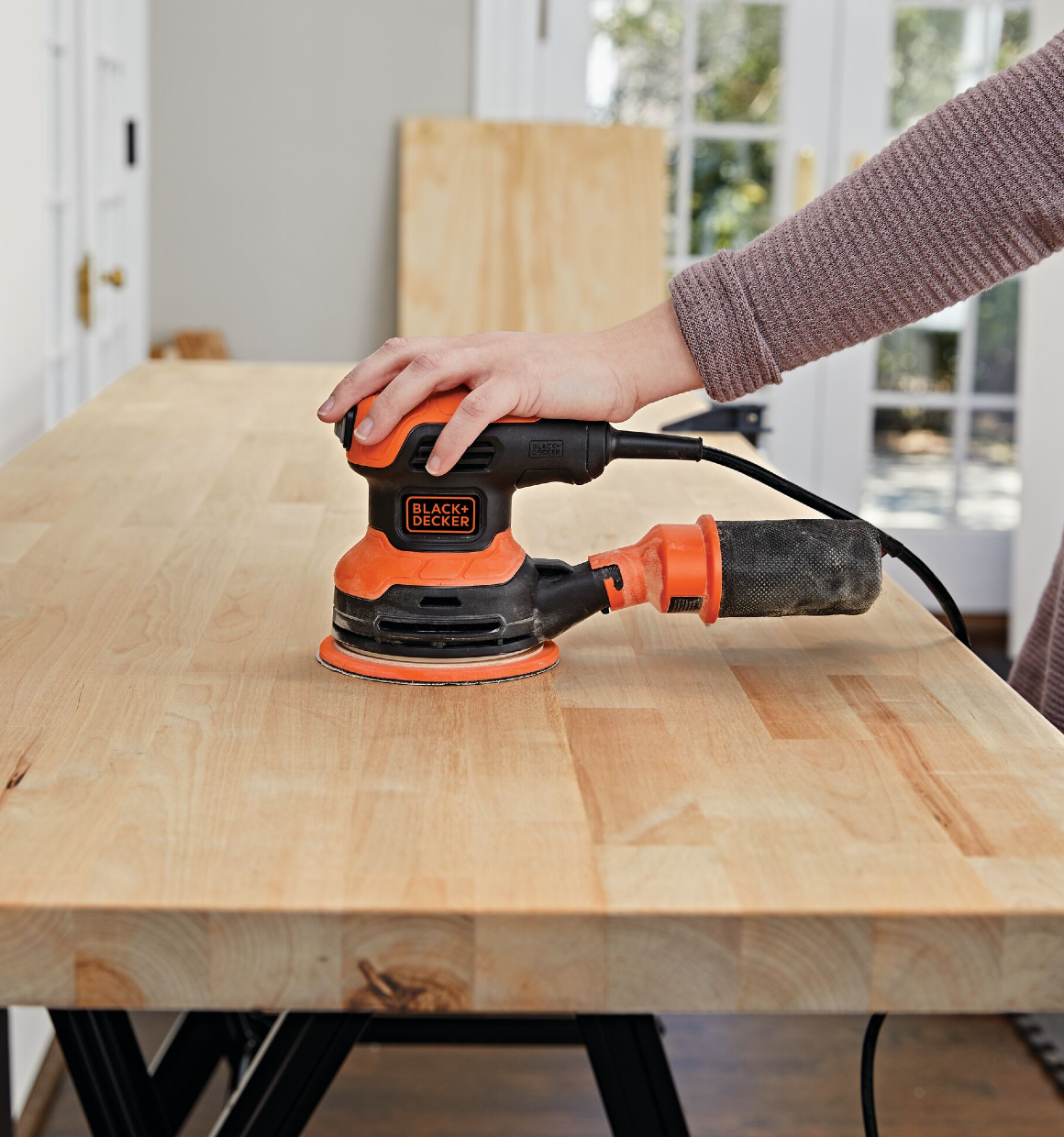 5 in. Random Orbit Sander being used to smooth a tabletop.