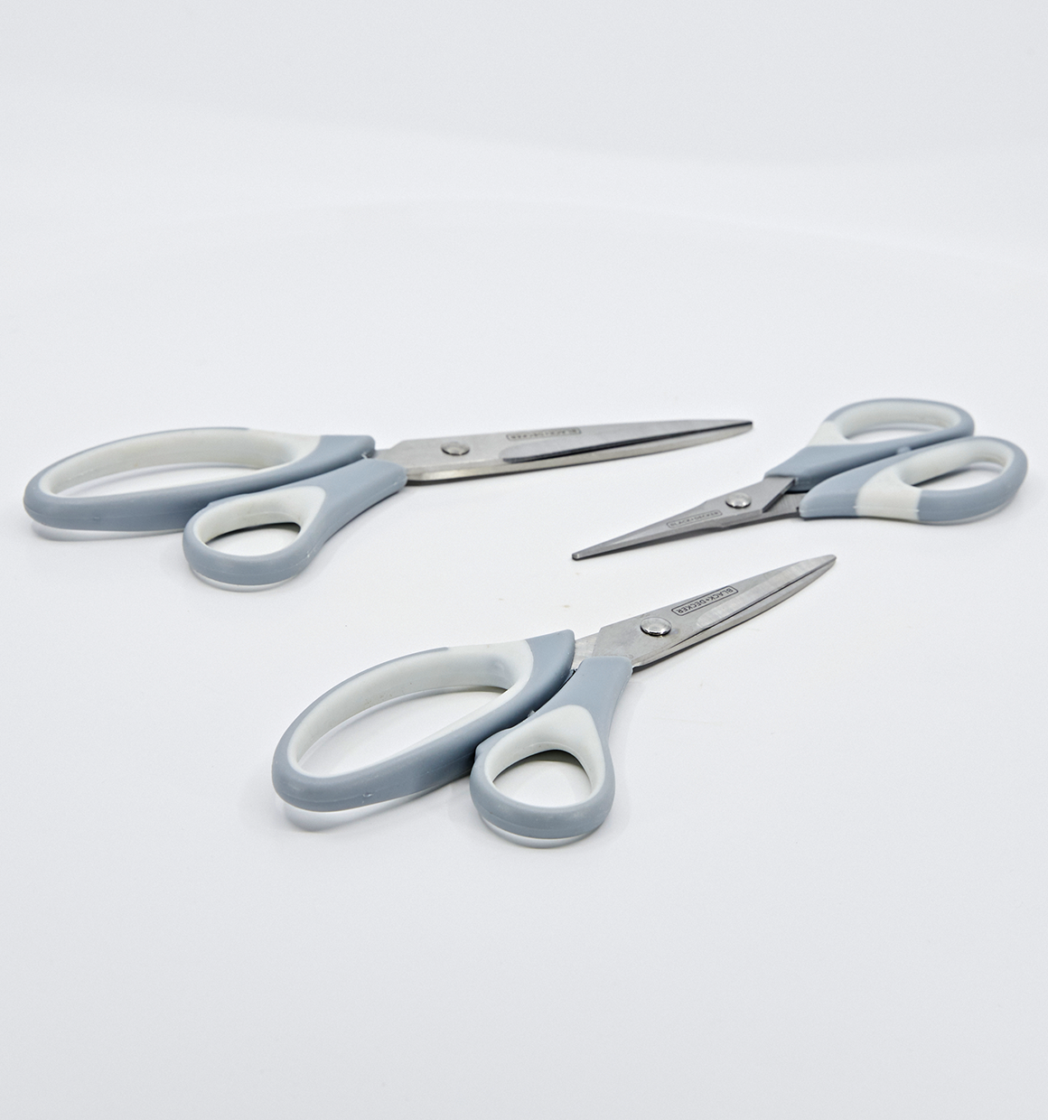Scissors laying on white background