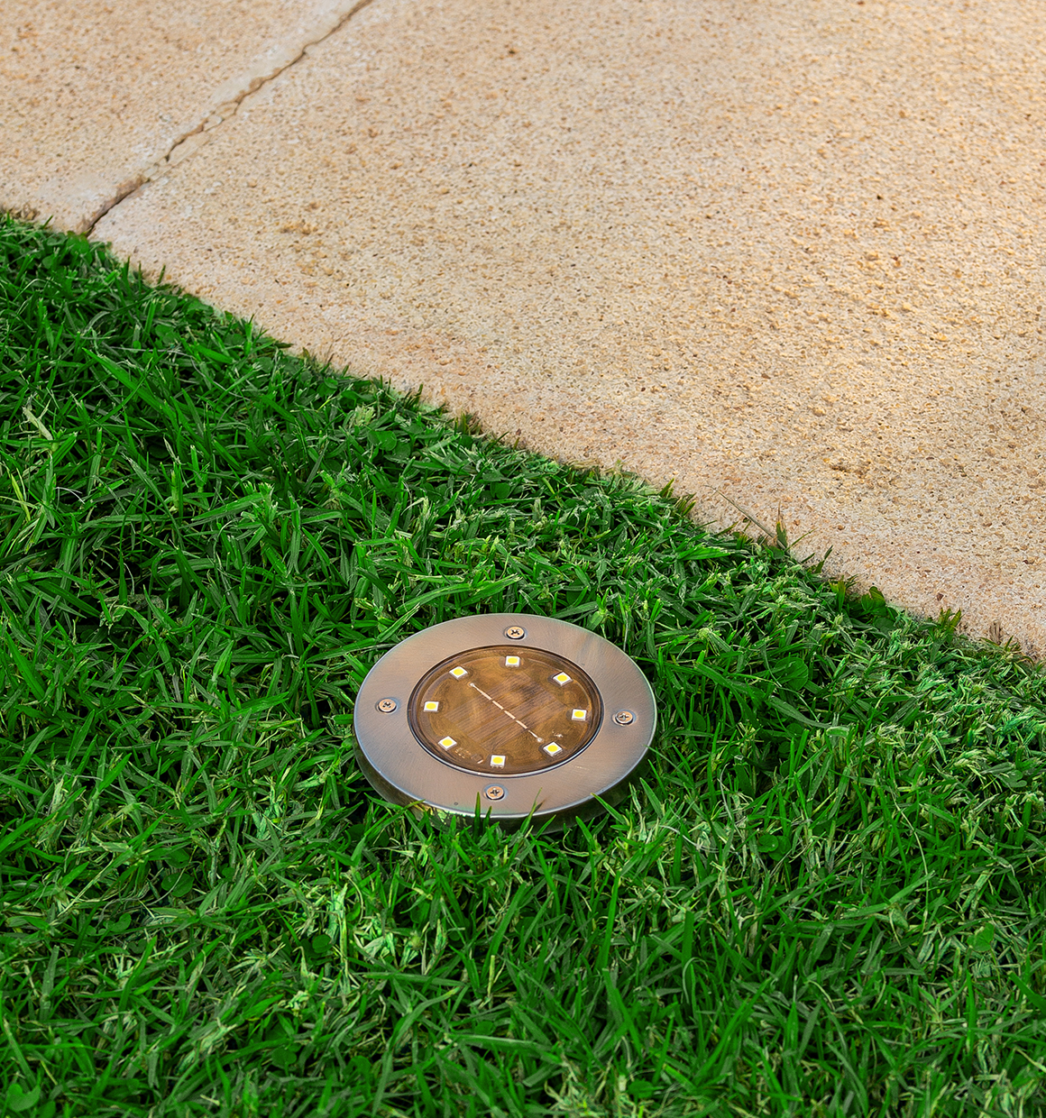 BLACK+DECKER Solar Disk Light placed along walkway.