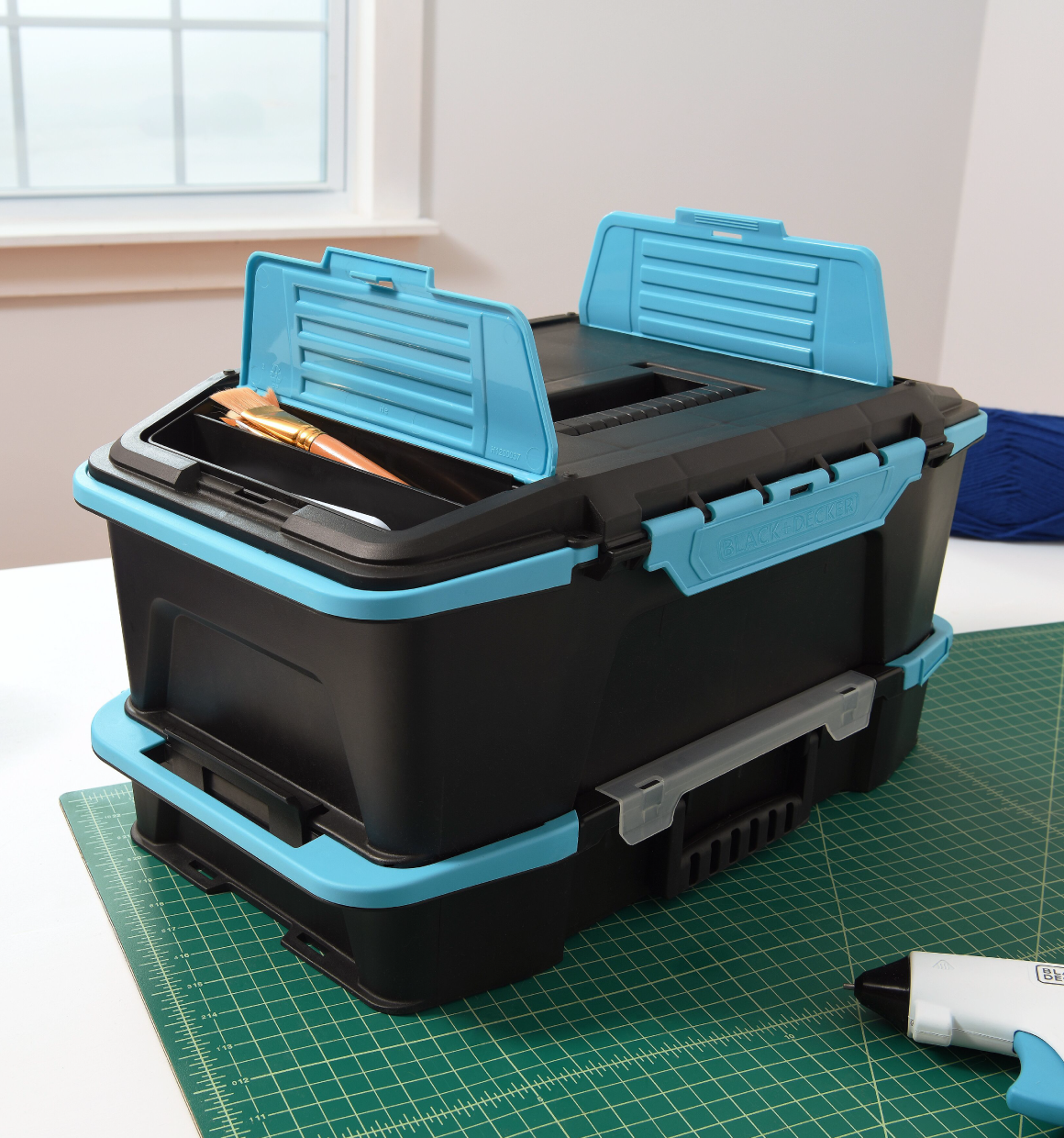 BLACK+DECKER crafting caddy and organizer set stacked together with the small compartments on the lid opened