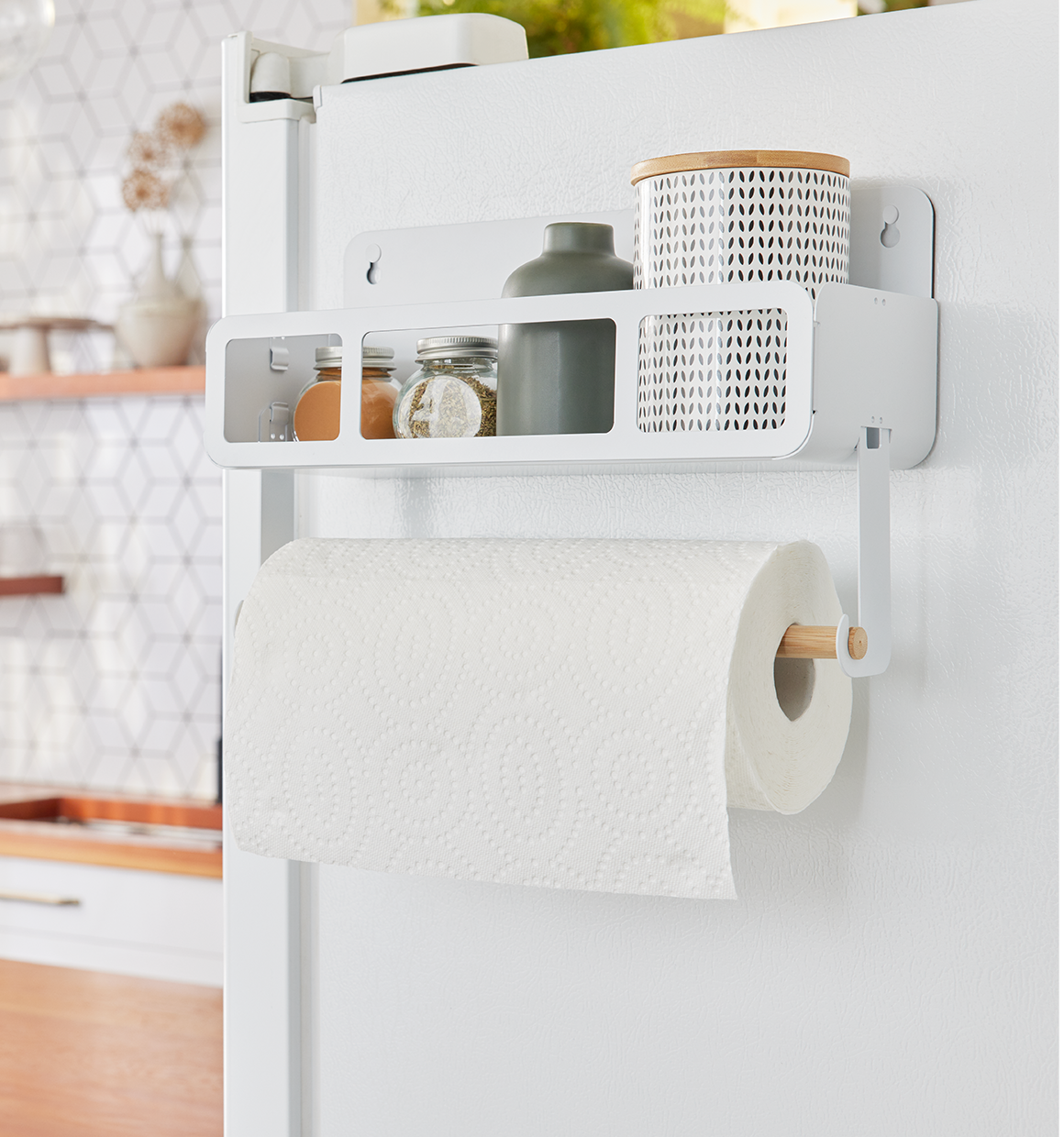 Hanging Rack System-Shelf W/Brackets hanging on fridge with misc. containers in shelf and paper towels on the bamboo rod.