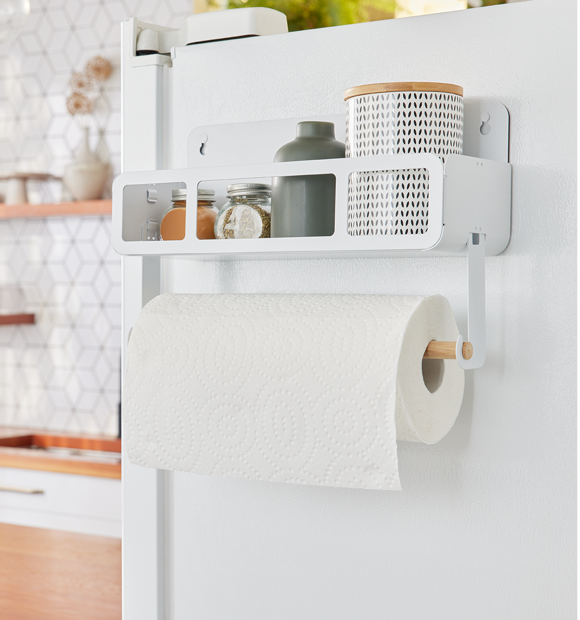 Hanging Rack System-Shelf W/Brackets hanging on fridge with misc. containers in shelf and paper towels on the bamboo rod.