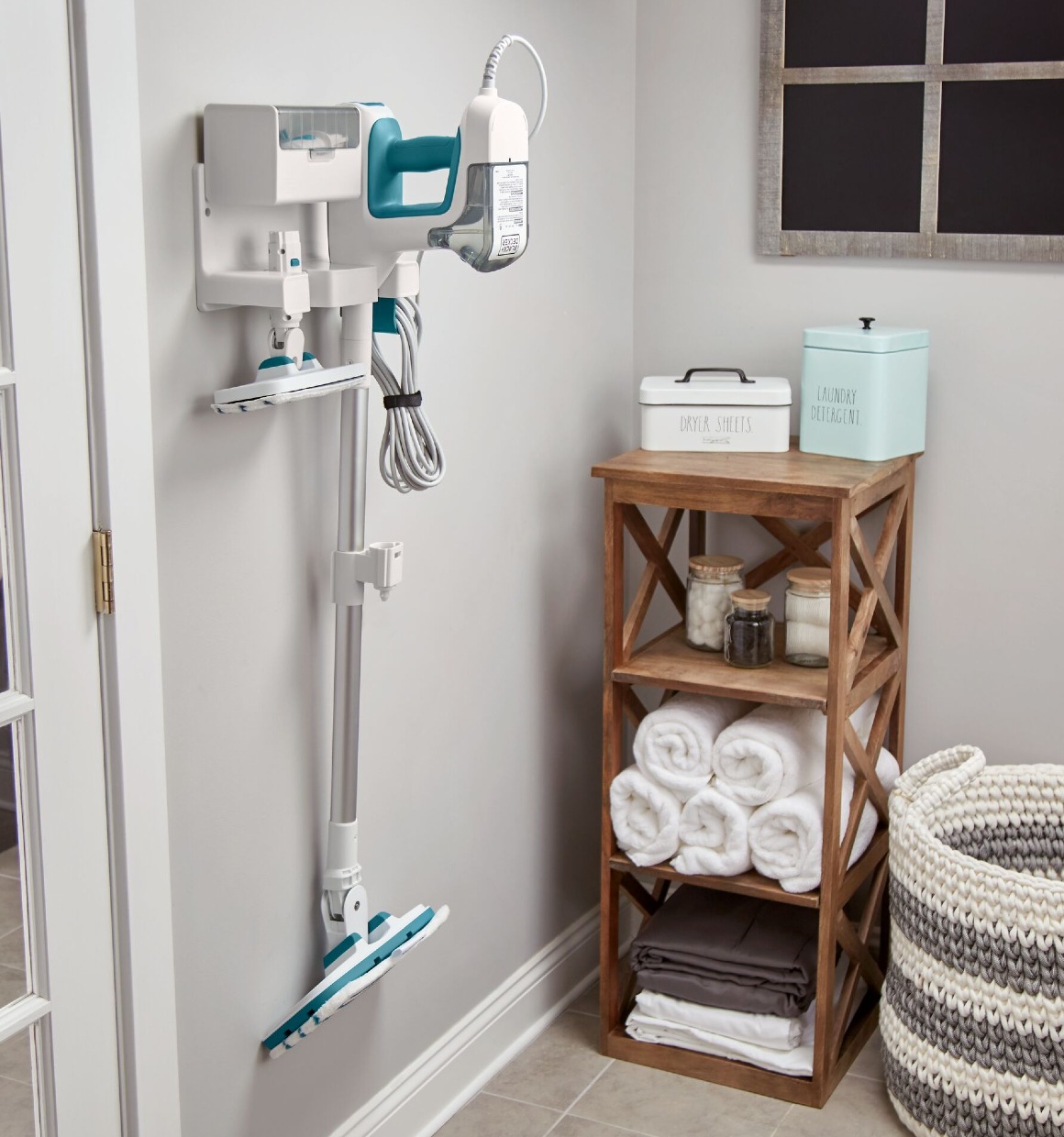 Multipurpose Steam Cleaning System mounted on wall in laundry room on the wall storage mount accessory