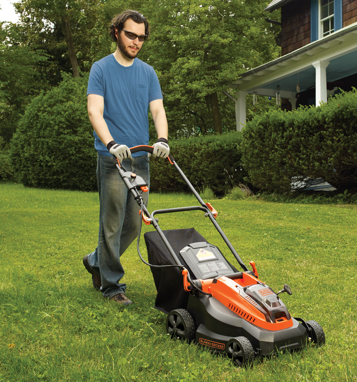 40 volt MAX lithium 16 inch mower being used by a person to mow grass.