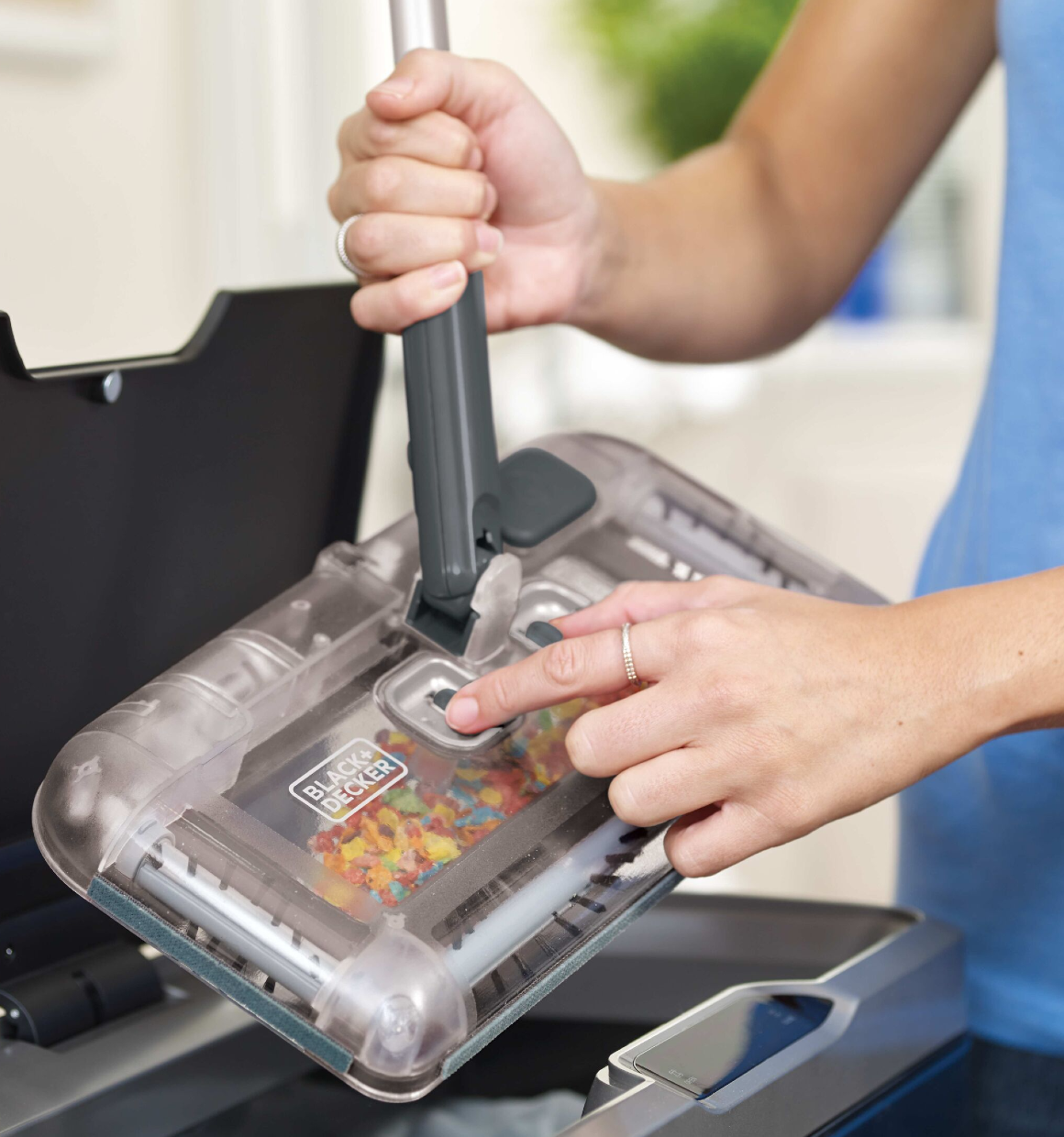 Instant emptying into the trash can feature of 100 Minute Powered Floor Sweeper Charcoal Grey.