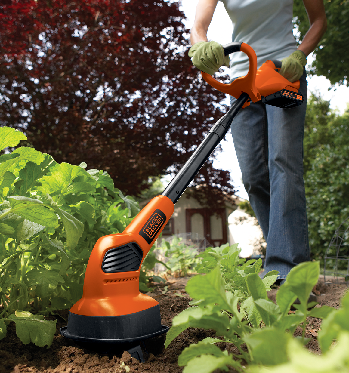 20 volt MAX Lithium Garden Cultivator being used by a person outdoors.