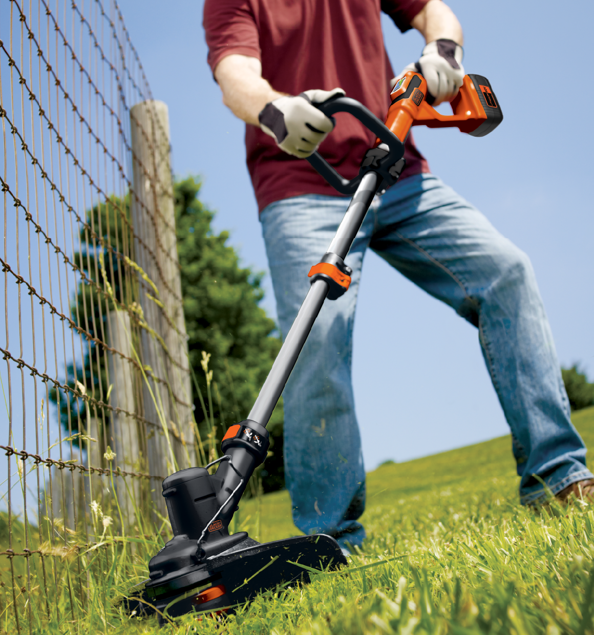 Lithium String Trimmer with powercommand being used for trimming grass from edges.