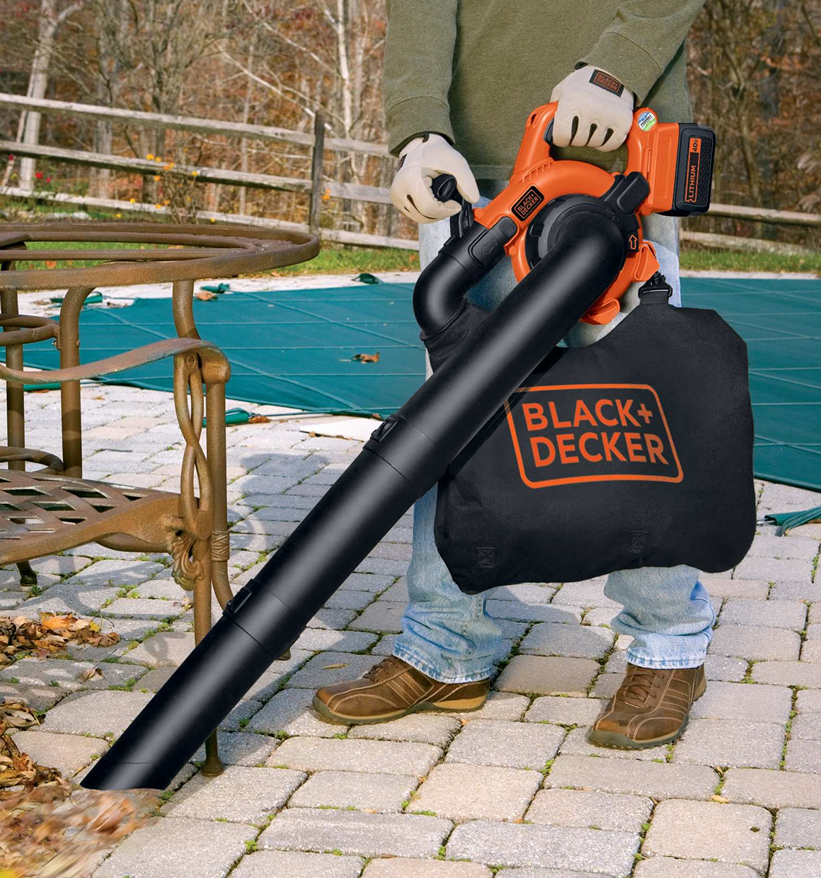 40 volt MAX lithium sweeper and vacuum being used by a person to clean mess from a patio.