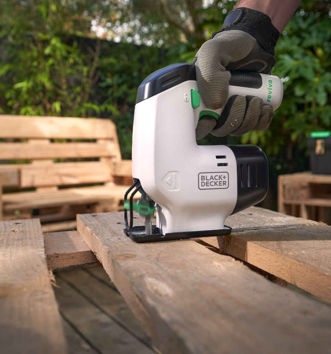 Close-up of a Reviva 12V Jigsaw sawing a pallet.