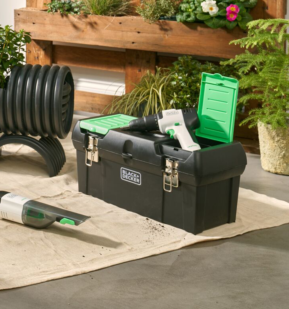 BLACK+DECKER reviva toolbox on the floor next to other reviva tools.