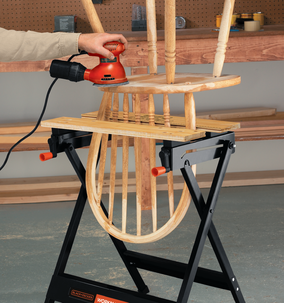 Workmate Portable Project Center and Vise being used to work on a wooden chair by a person.