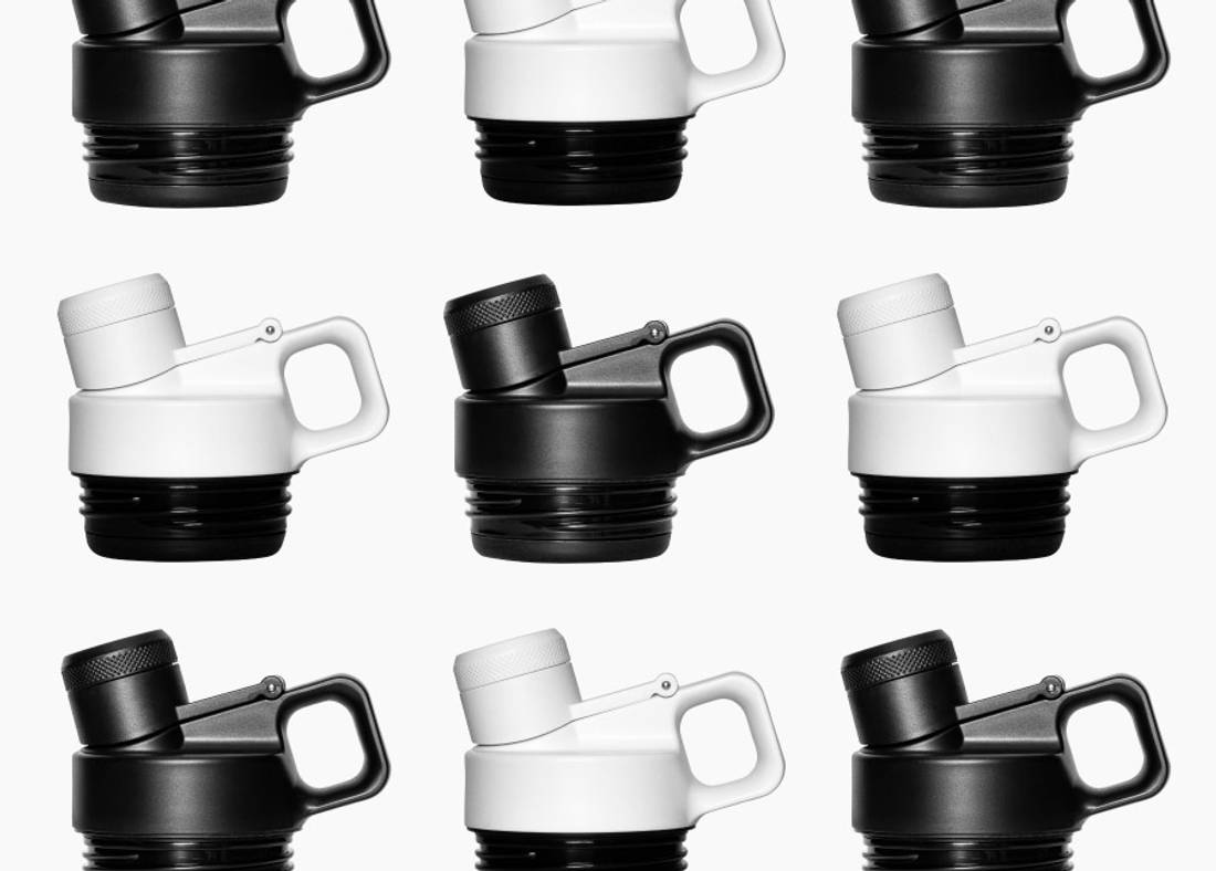 An assortment of Leakproof Chug Lids in black & white.