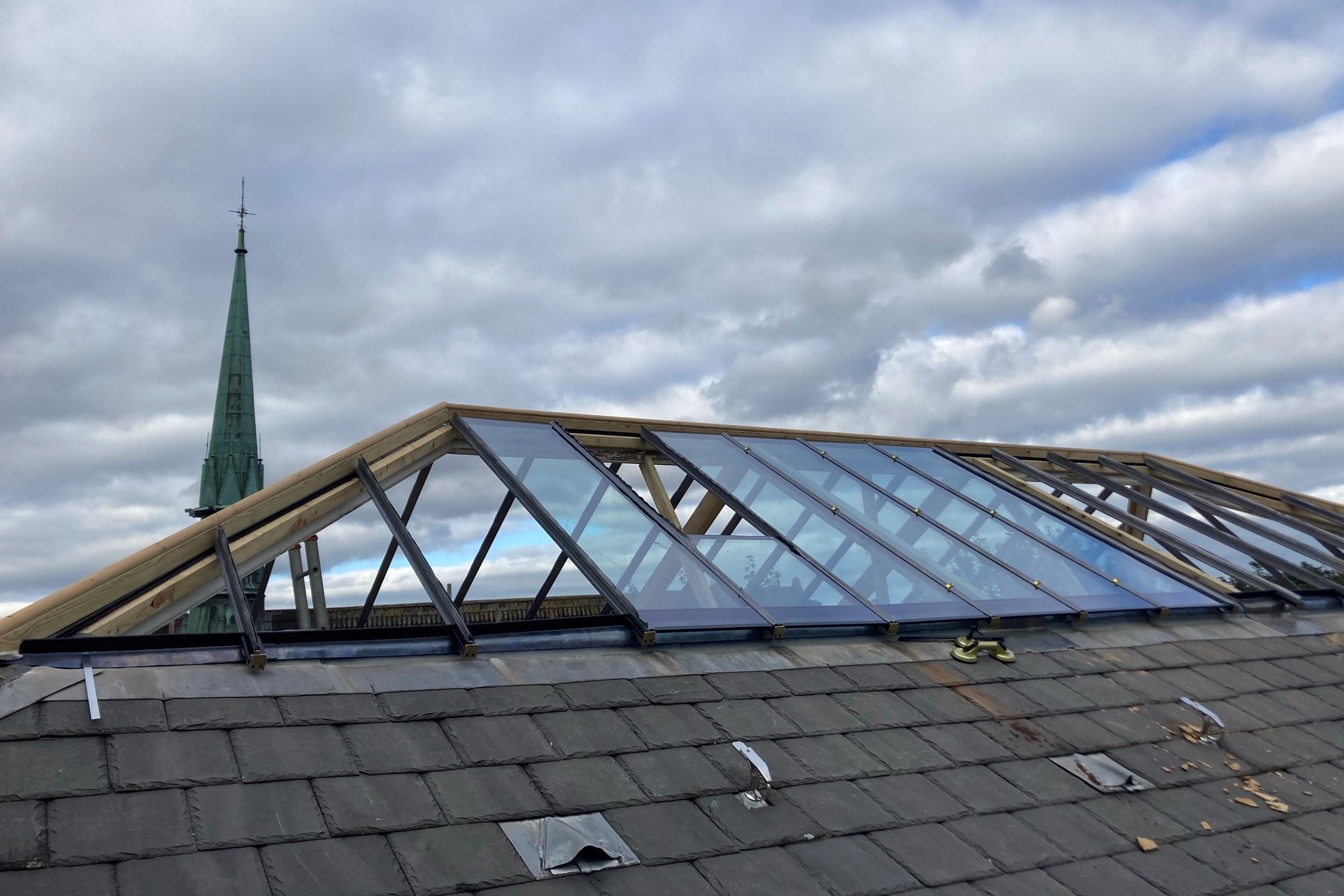 View of the RWA rooftop and windows with sky in the background 